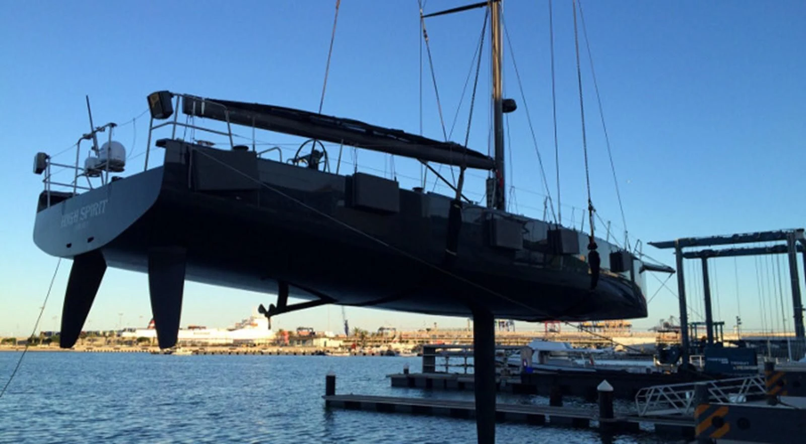 a large boat docked at a pier aboard HIGH SPIRIT Yacht for Sale