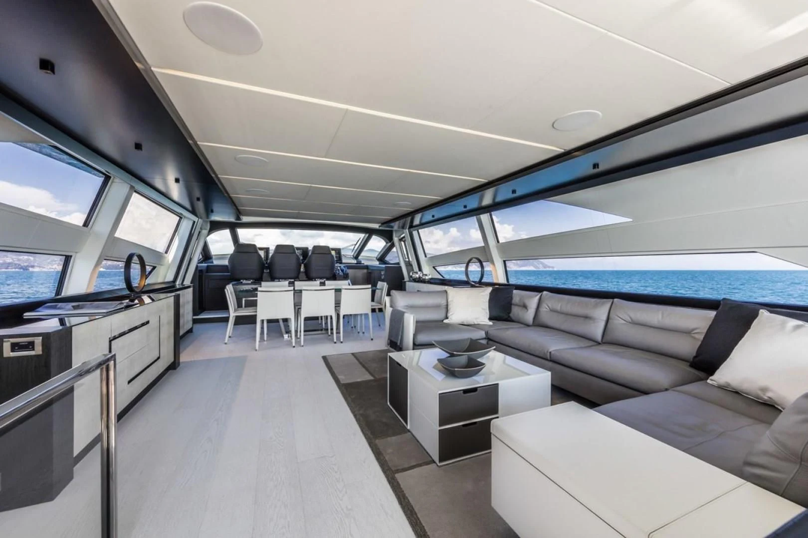 inside of a vehicle with a large window and a view of the ocean aboard OUR TRADE Yacht for Sale