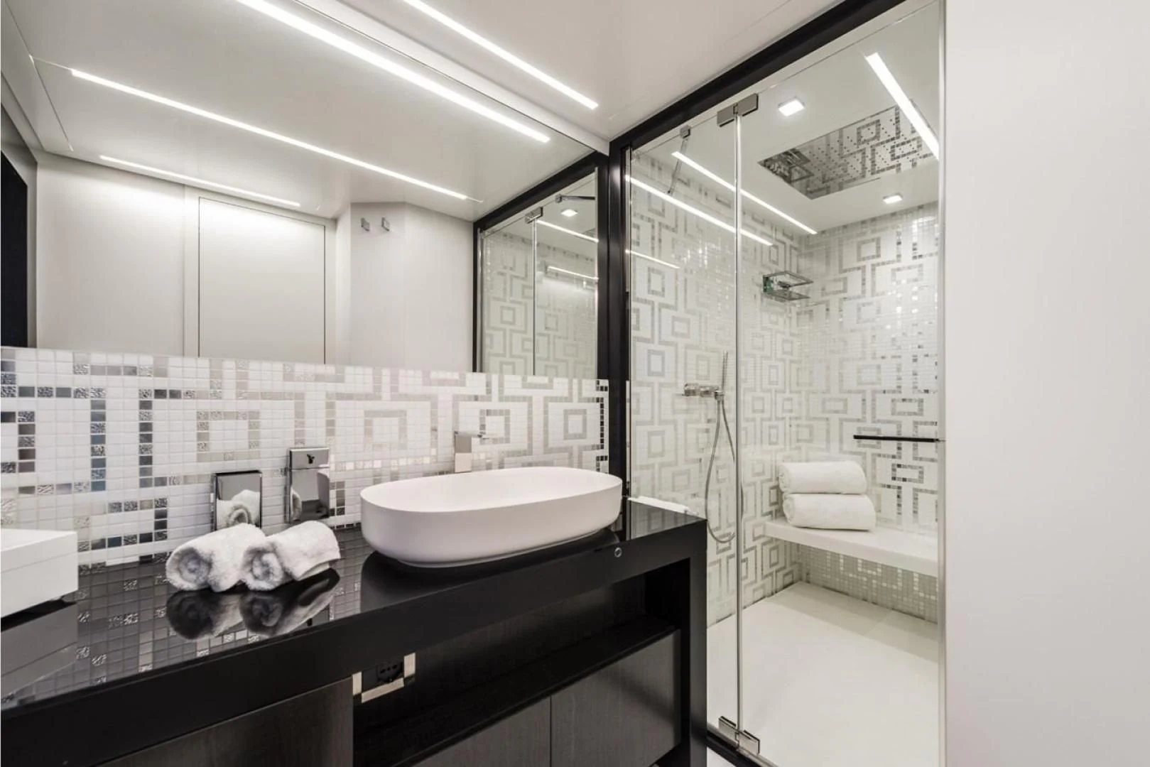 a bathroom with a sink and a mirror aboard OUR TRADE Yacht for Sale