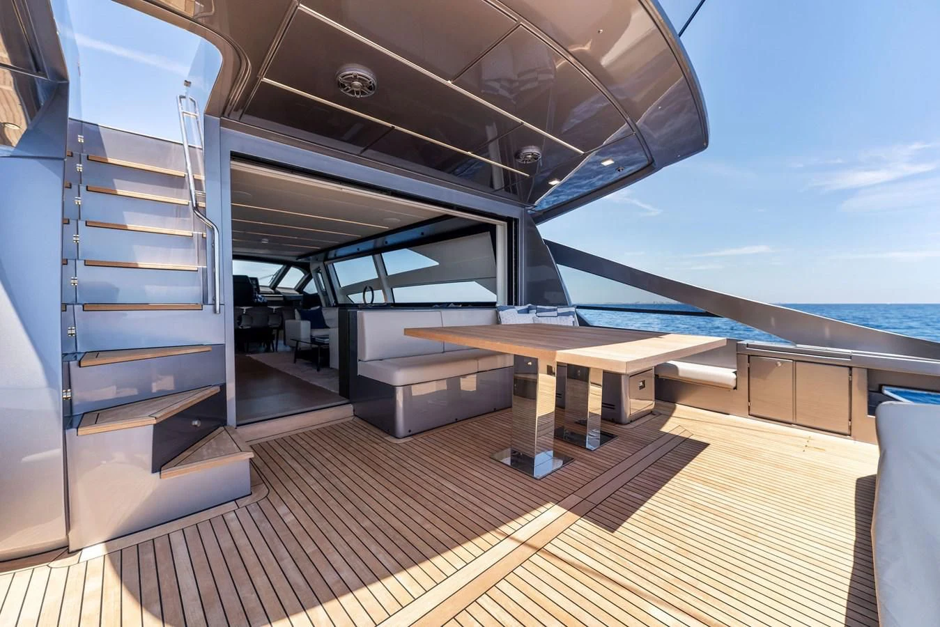 a room with a wood floor and a large metal staircase aboard OUR TRADE Yacht for Sale
