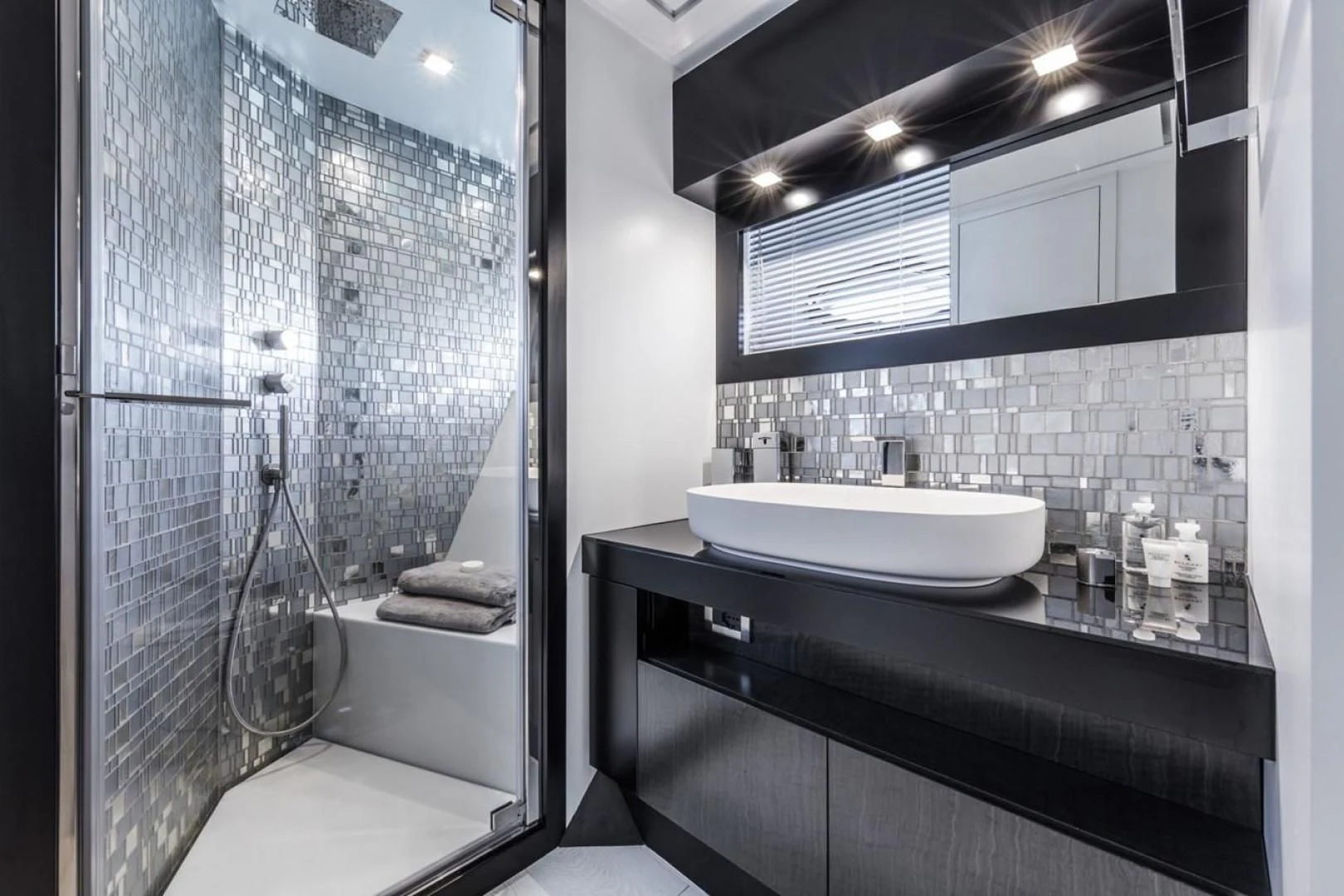 a bathroom with a glass shower aboard OUR TRADE Yacht for Sale