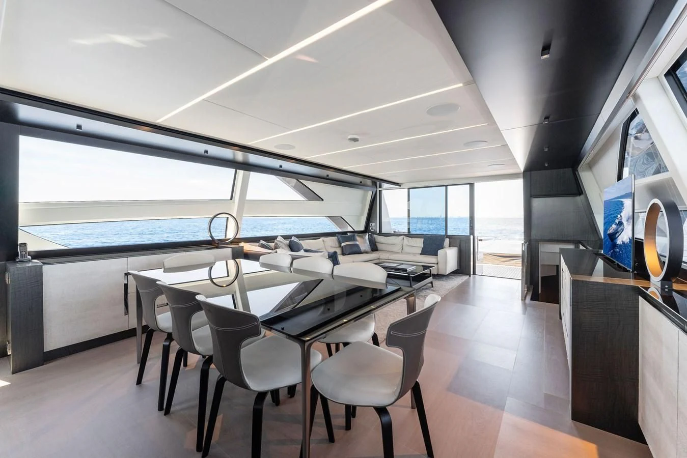 a room with tables and chairs aboard OUR TRADE Yacht for Sale