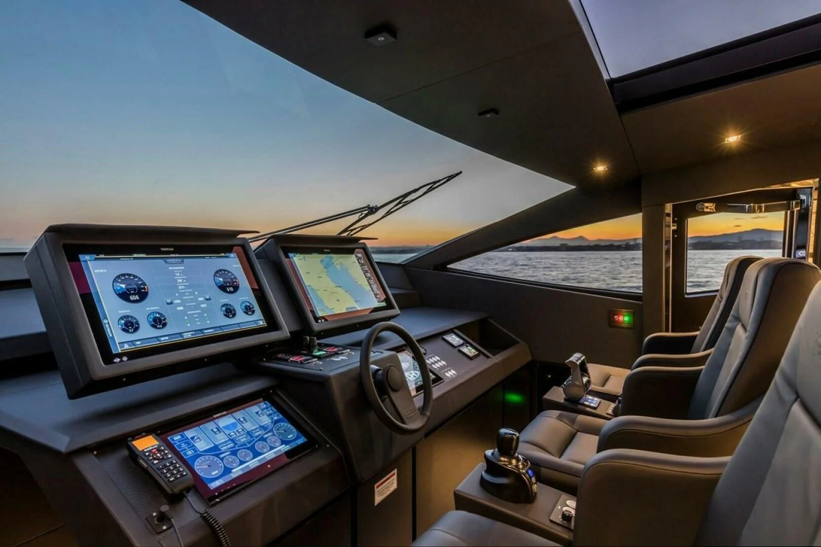 a plane with a desk and computer aboard OUR TRADE Yacht for Sale