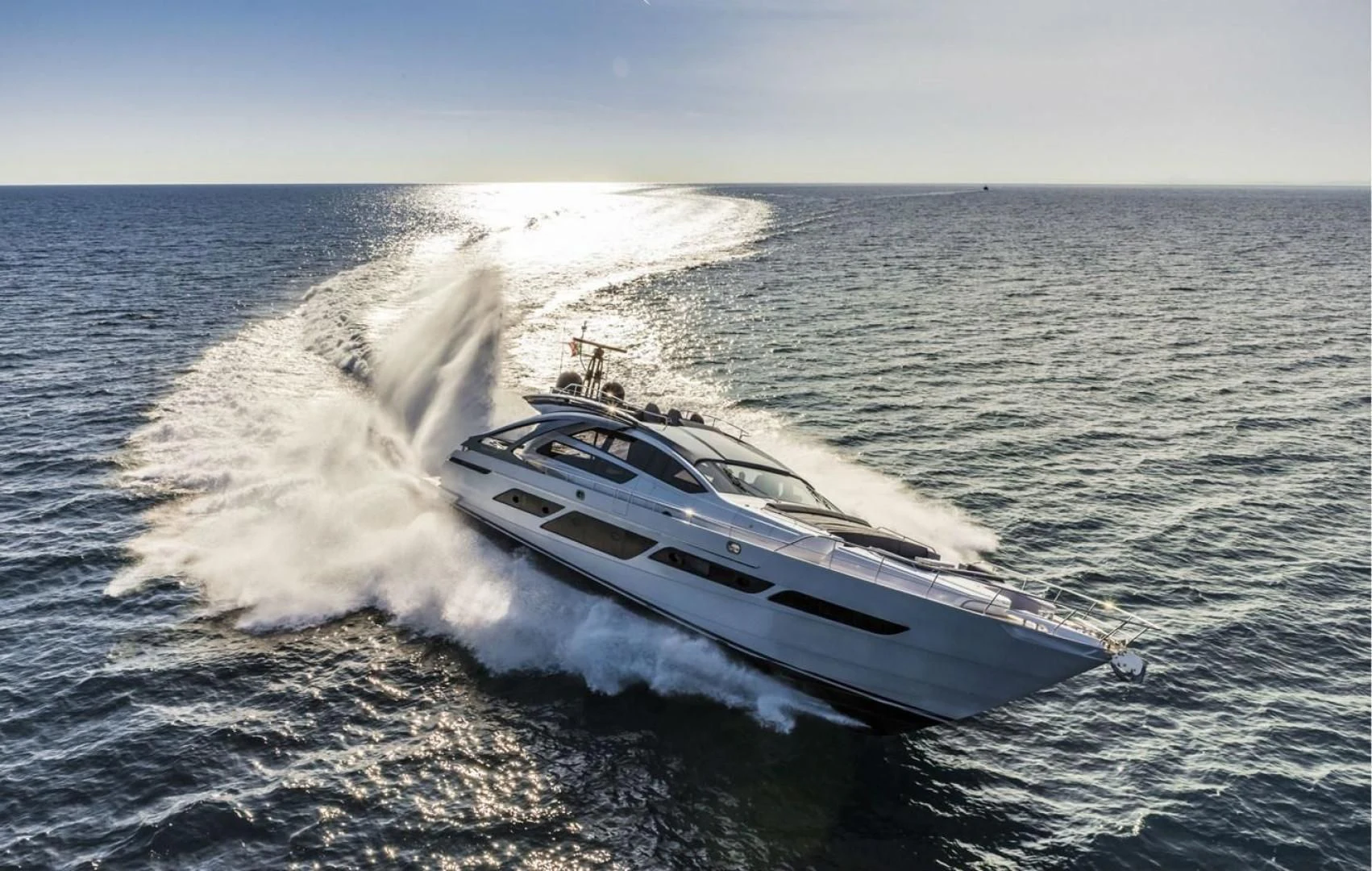 a car driving on a body of water aboard OUR TRADE Yacht for Sale