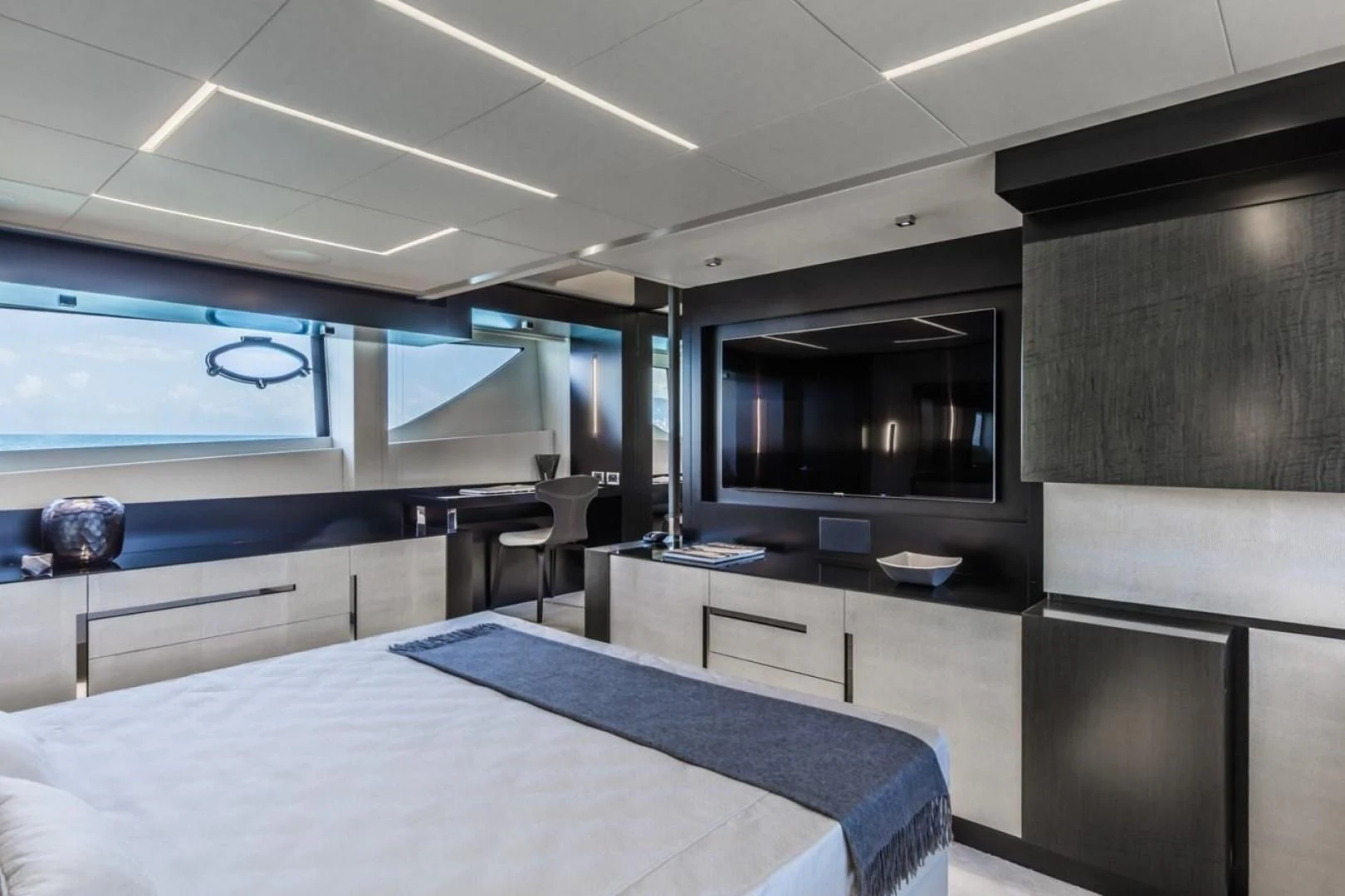 a room with a table and tv aboard OUR TRADE Yacht for Sale