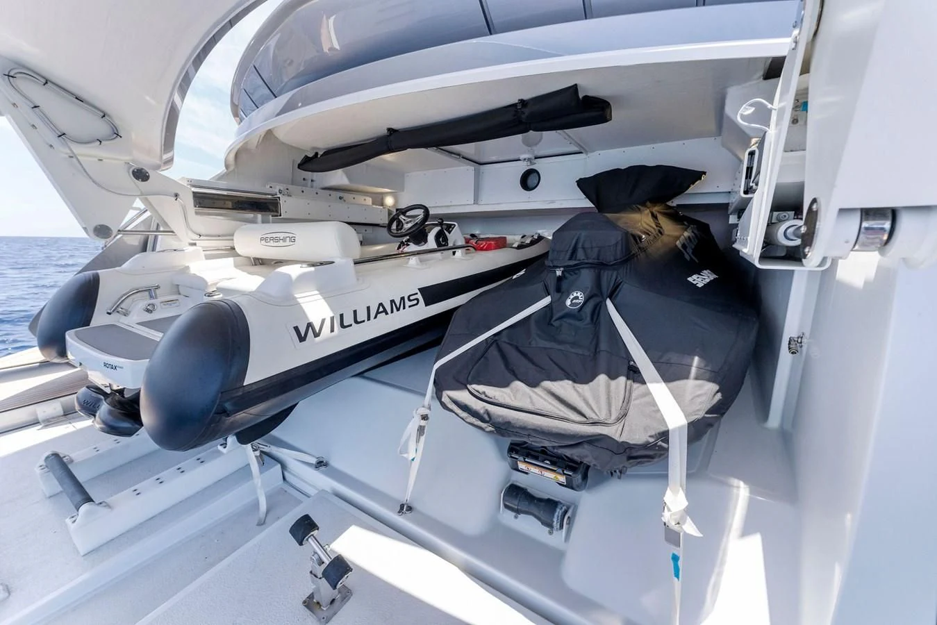 a person sitting in a cockpit aboard OUR TRADE Yacht for Sale