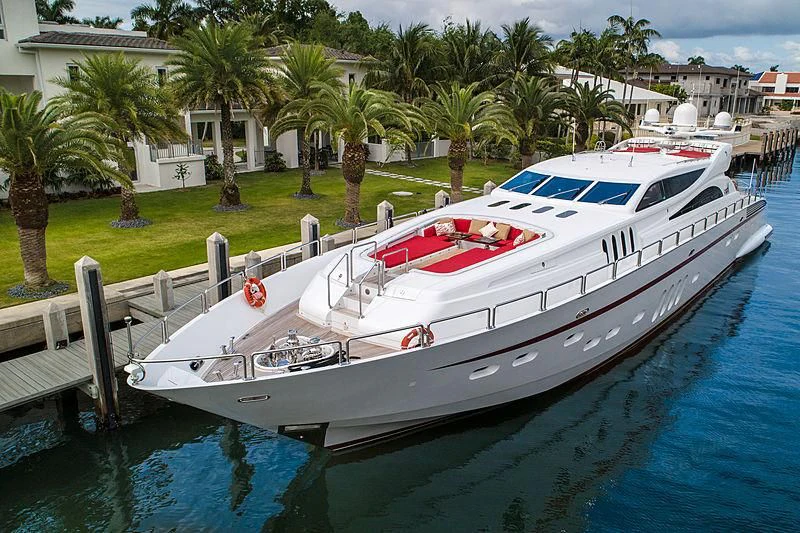 a white boat on a dock aboard GO Yacht for Sale