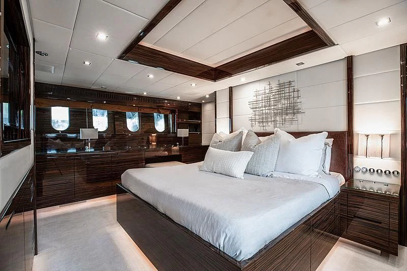 a large bed in a room aboard GO Yacht for Sale