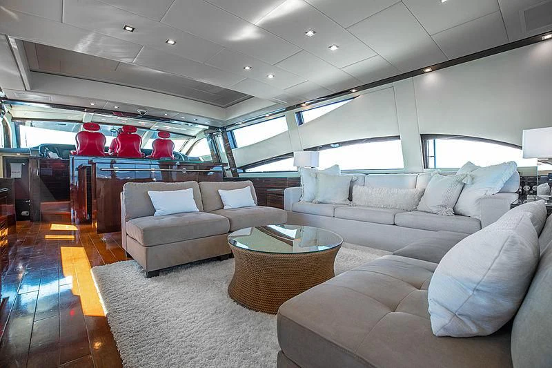 a living room with a couch and a table aboard GO Yacht for Sale