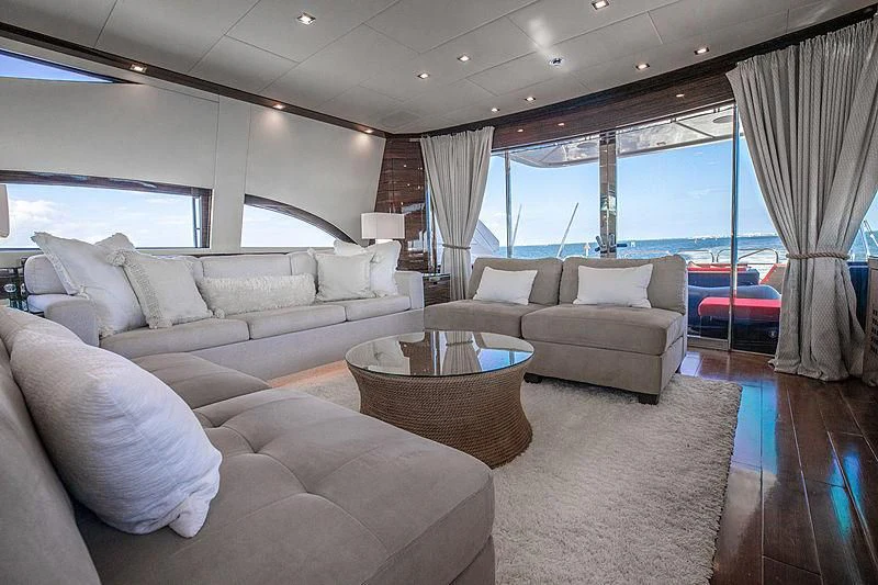 a living room with a large window aboard GO Yacht for Sale