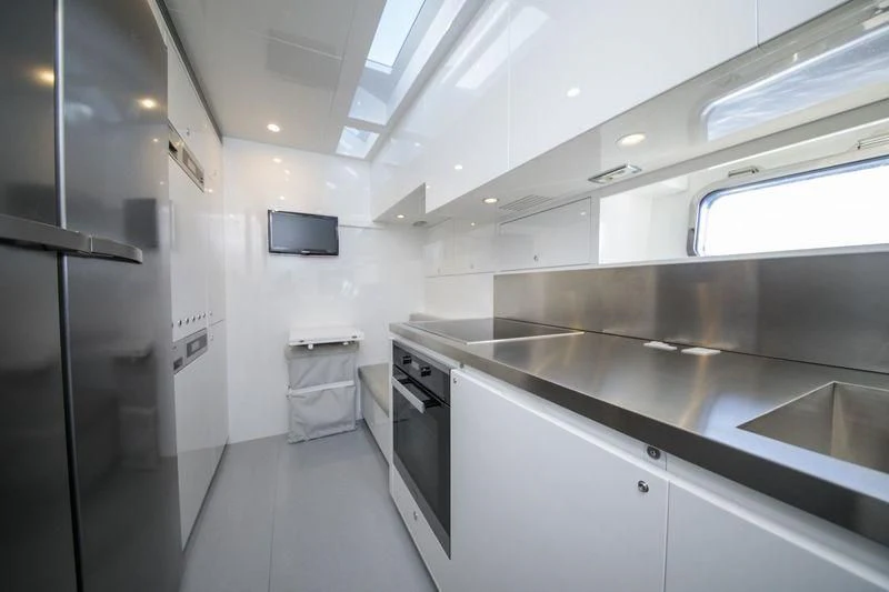 a kitchen with stainless steel appliances aboard MYSTERE Yacht for Sale