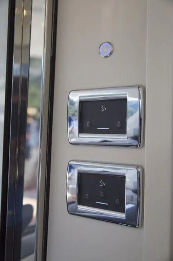 a rectangular electronic device on a wall aboard MYSTERE Yacht for Sale