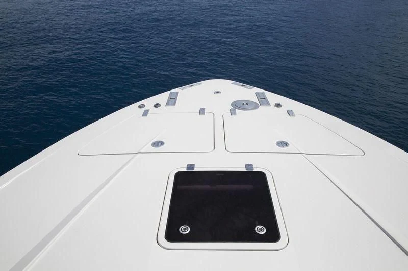 a white rectangular object with a black screen on a surface with water in the background aboard MYSTERE Yacht for Sale