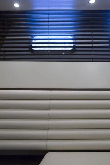 a white wall with black and blue stripes aboard MYSTERE Yacht for Sale