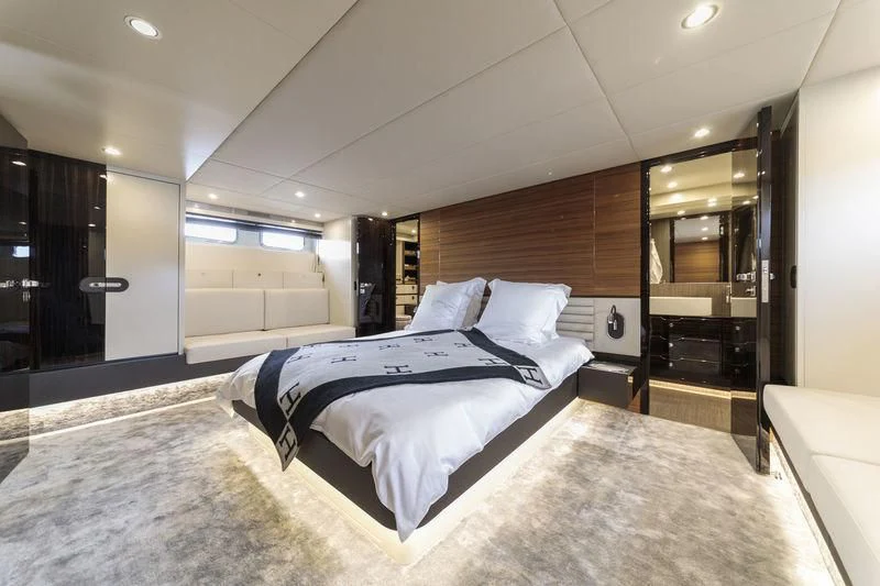 a large bedroom with a large bed aboard MYSTERE Yacht for Sale