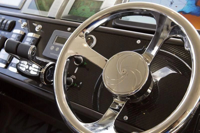 the steering wheel and dashboard of a car aboard MYSTERE Yacht for Sale