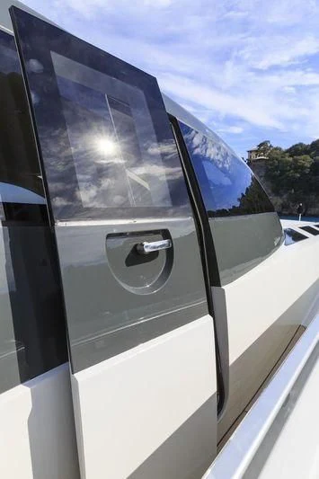 a white car with a blue door aboard MYSTERE Yacht for Sale