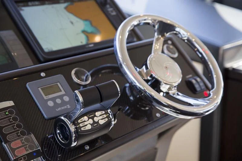 a steering wheel and dashboard of a car aboard MYSTERE Yacht for Sale