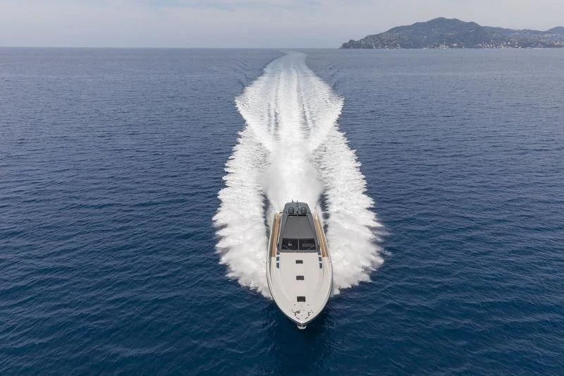 a boat with a large white fin coming out of the water aboard MYSTERE Yacht for Sale