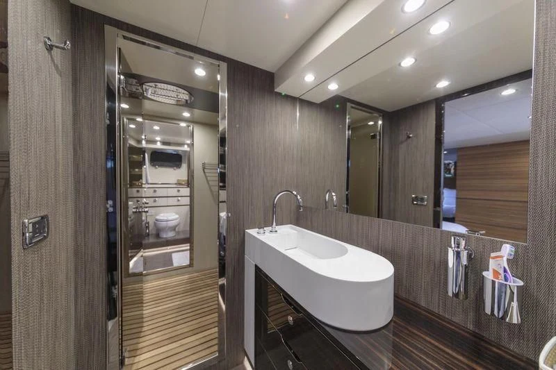 a bathroom with a large mirror aboard MYSTERE Yacht for Sale