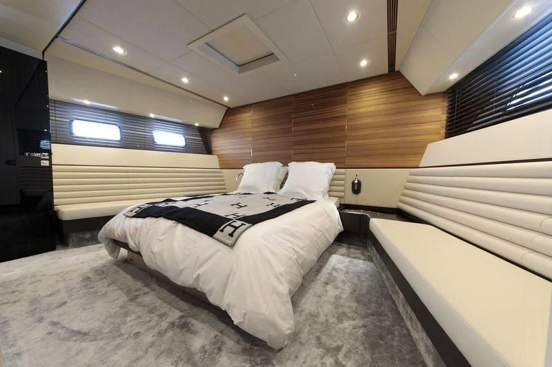 a room with beds and a wood wall aboard MYSTERE Yacht for Sale