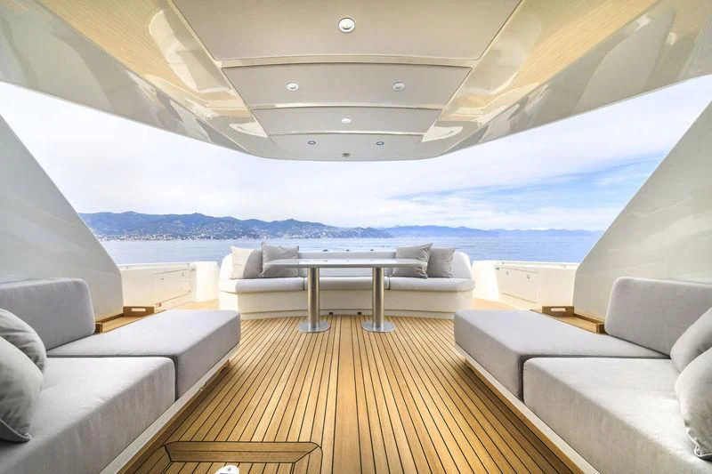a room with a couch and a table and a large body of water aboard MYSTERE Yacht for Sale