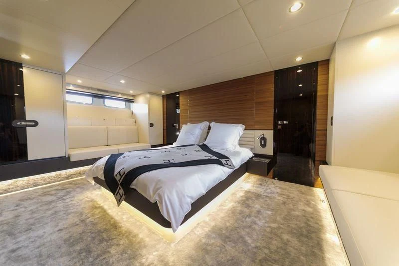 a large bed in a room aboard MYSTERE Yacht for Sale