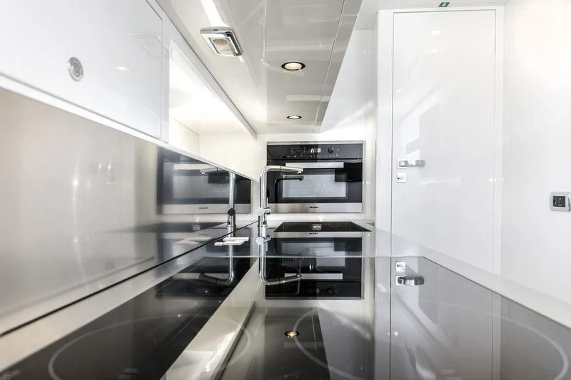 a kitchen with a glass door aboard MYSTERE Yacht for Sale