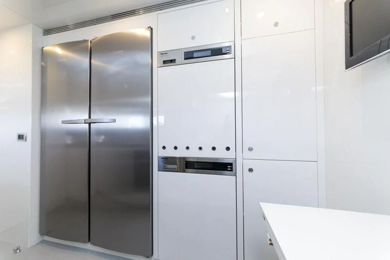 a room with white cabinets aboard MYSTERE Yacht for Sale