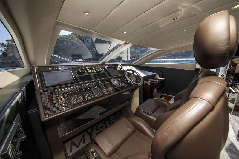 a cockpit with a large screen and a large gun aboard MYSTERE Yacht for Sale