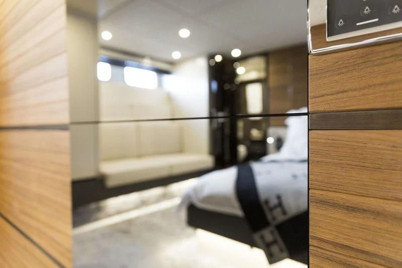 a cat lying on a bed aboard MYSTERE Yacht for Sale