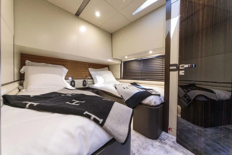a bed with black and white sheets aboard MYSTERE Yacht for Sale