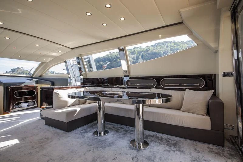 a couch and a table in a room aboard MYSTERE Yacht for Sale