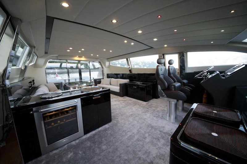 a large living room with a large kitchen and a large window aboard MYSTERE Yacht for Sale