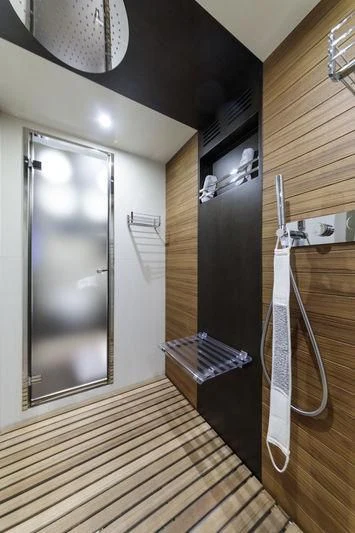 a room with a large mirror and a wood wall aboard MYSTERE Yacht for Sale