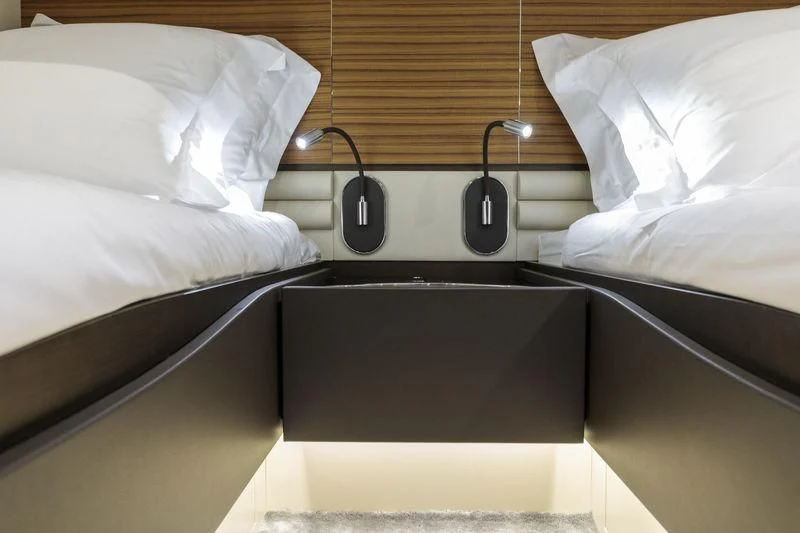 a bed with white sheets aboard MYSTERE Yacht for Sale