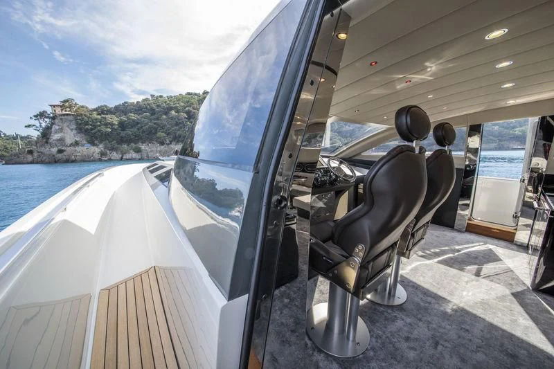 a person sitting in a car aboard MYSTERE Yacht for Sale