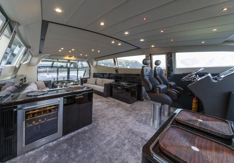 a large living room with a large window aboard MYSTERE Yacht for Sale