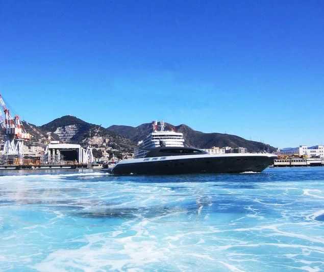 a large ship in the water aboard MYSTERE Yacht for Sale