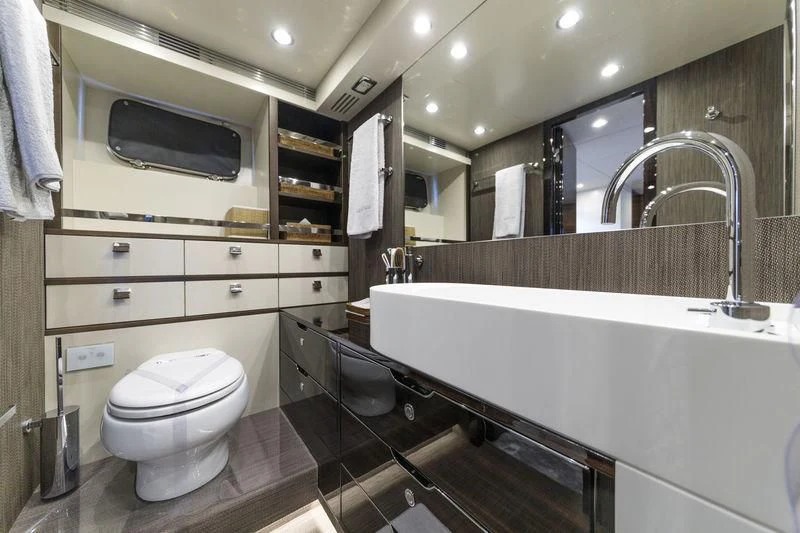 a bathroom with a large mirror aboard MYSTERE Yacht for Sale