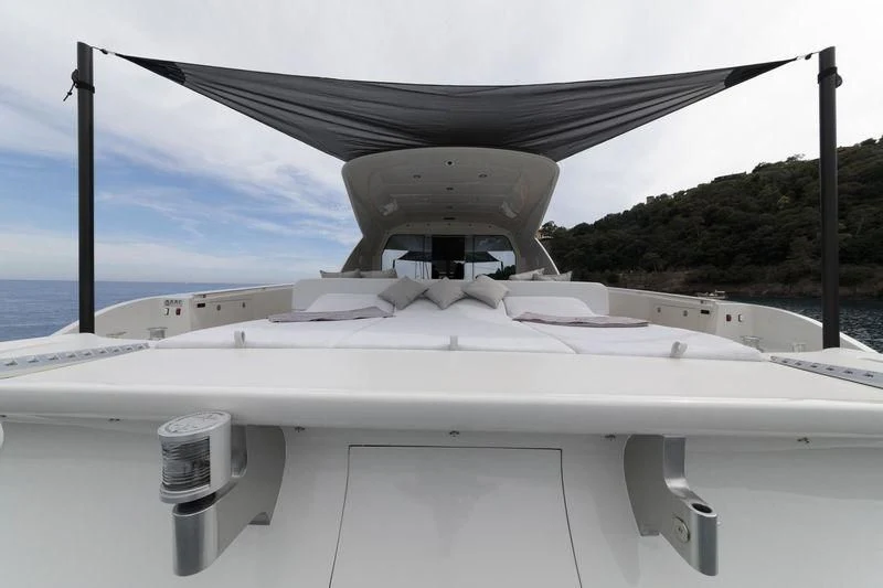 a white boat on a dock aboard MYSTERE Yacht for Sale