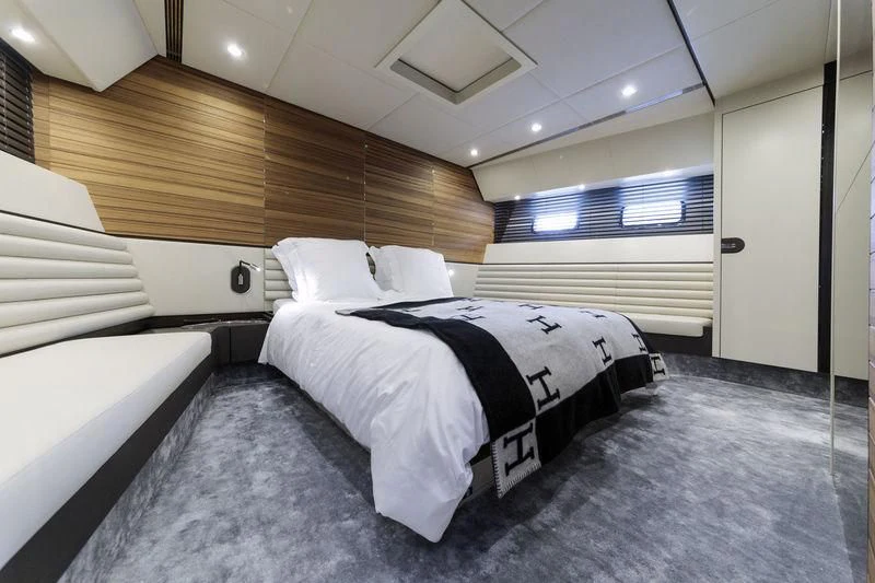 a room with beds and a wood wall aboard MYSTERE Yacht for Sale