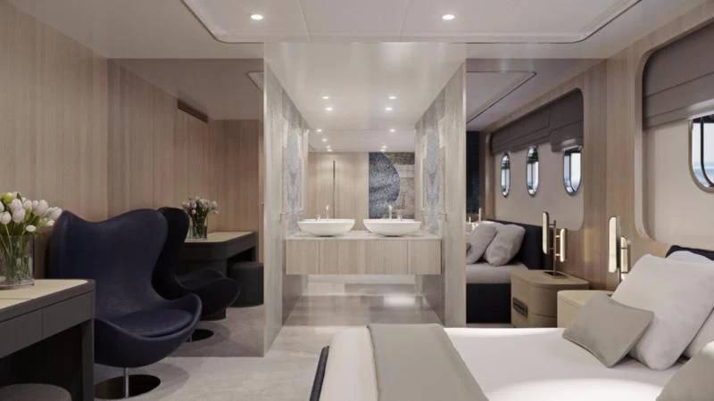 a room with a bed and a chair aboard MAIA Yacht for Sale