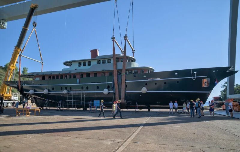 a large ship docked aboard MAIA Yacht for Sale