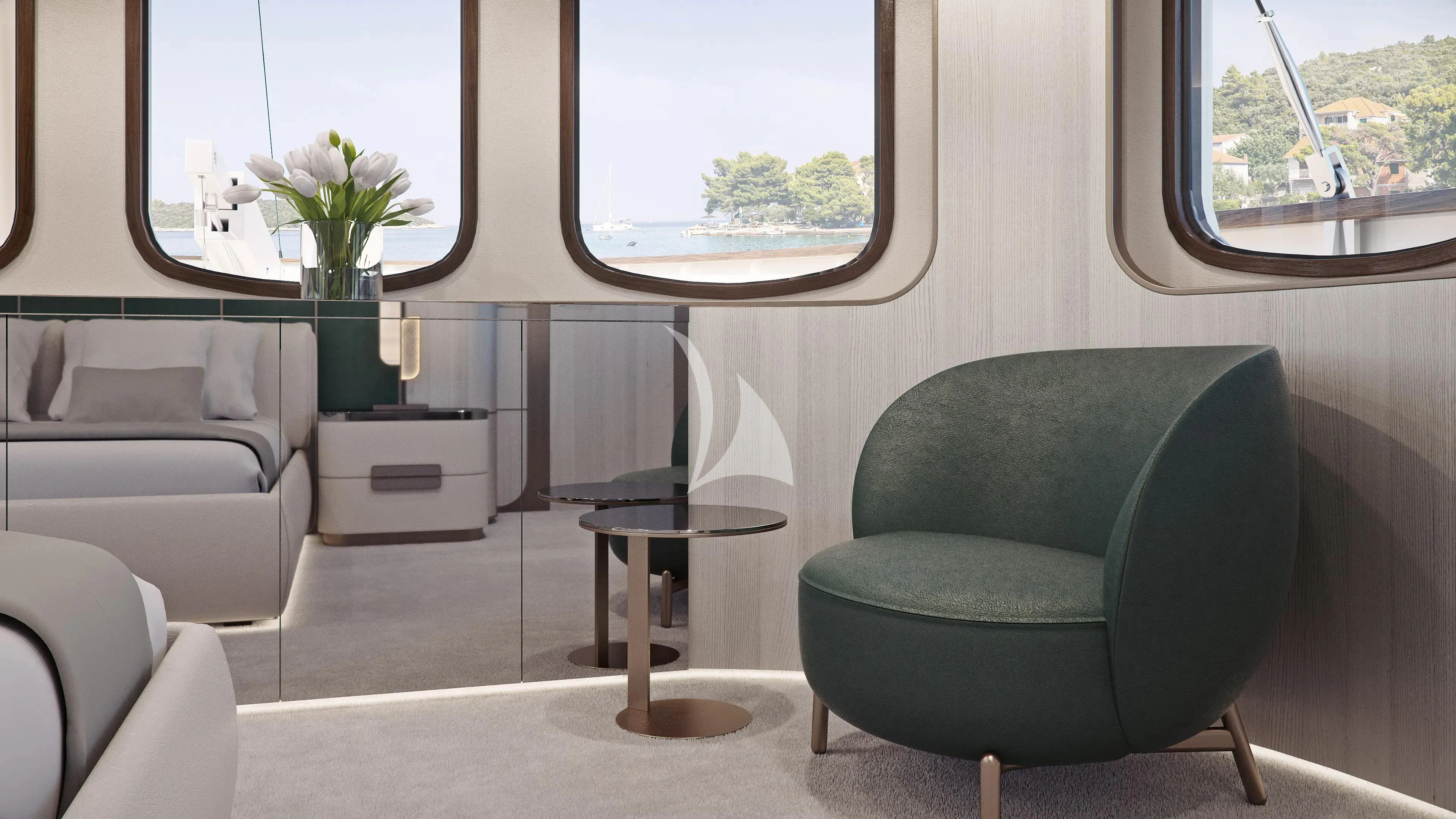 a room with a chair and a table and a plant in a pot aboard MAIA Yacht for Sale