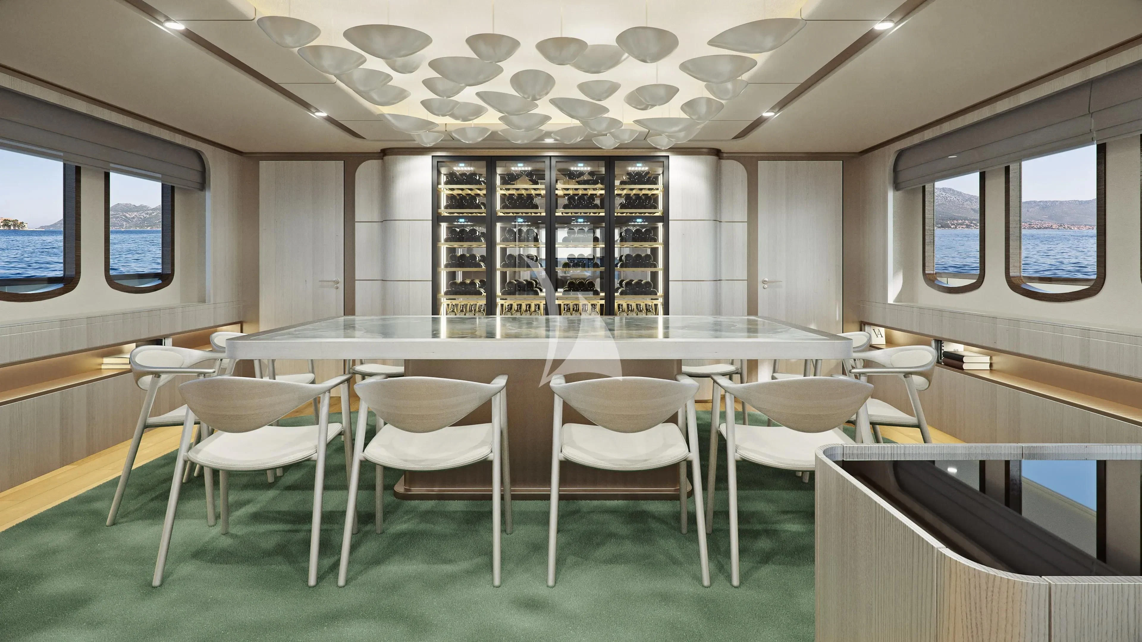 a room with tables and chairs aboard MAIA Yacht for Sale