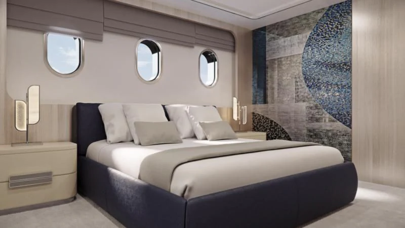 a bed with white pillows aboard MAIA Yacht for Sale