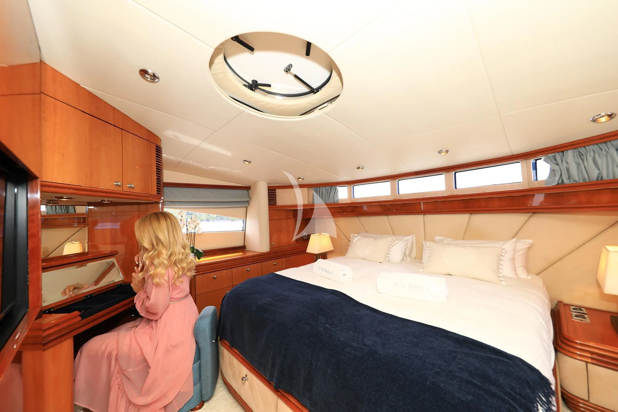 a person in a bedroom aboard BABY I Yacht for Sale