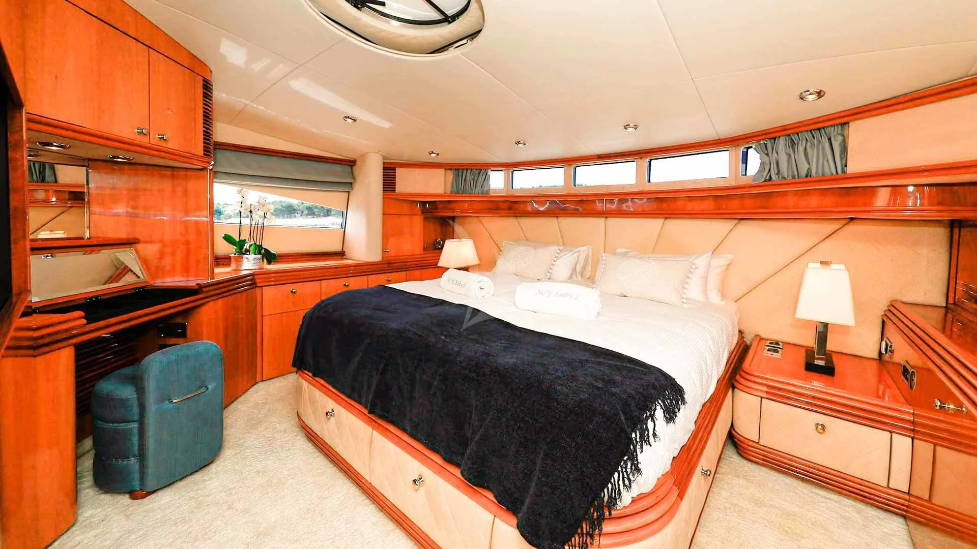 a bedroom with a bed and a desk aboard BABY I Yacht for Sale