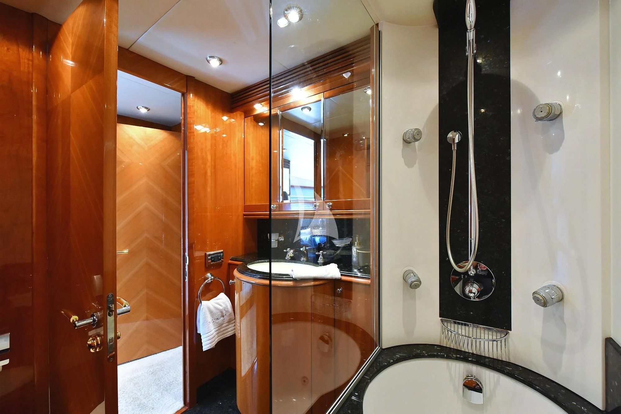 a bathroom with a shower and sink aboard BABY I Yacht for Sale